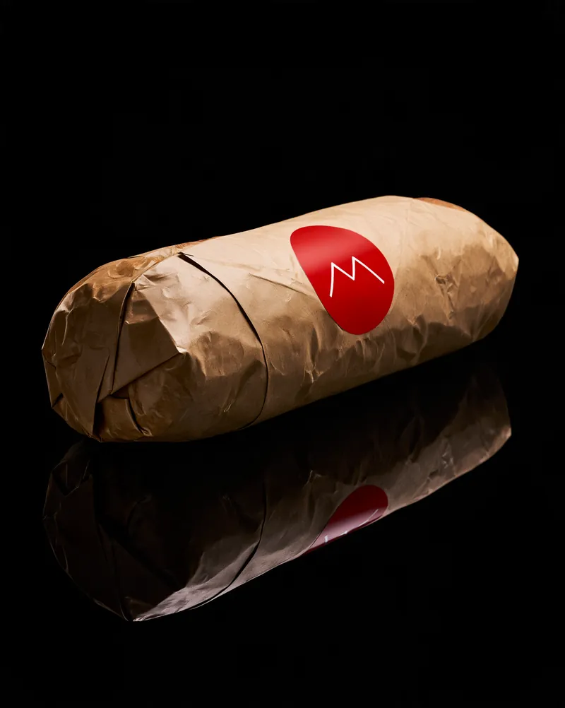 Cold Mountain sub wrapped in kraft paper with a red seal.