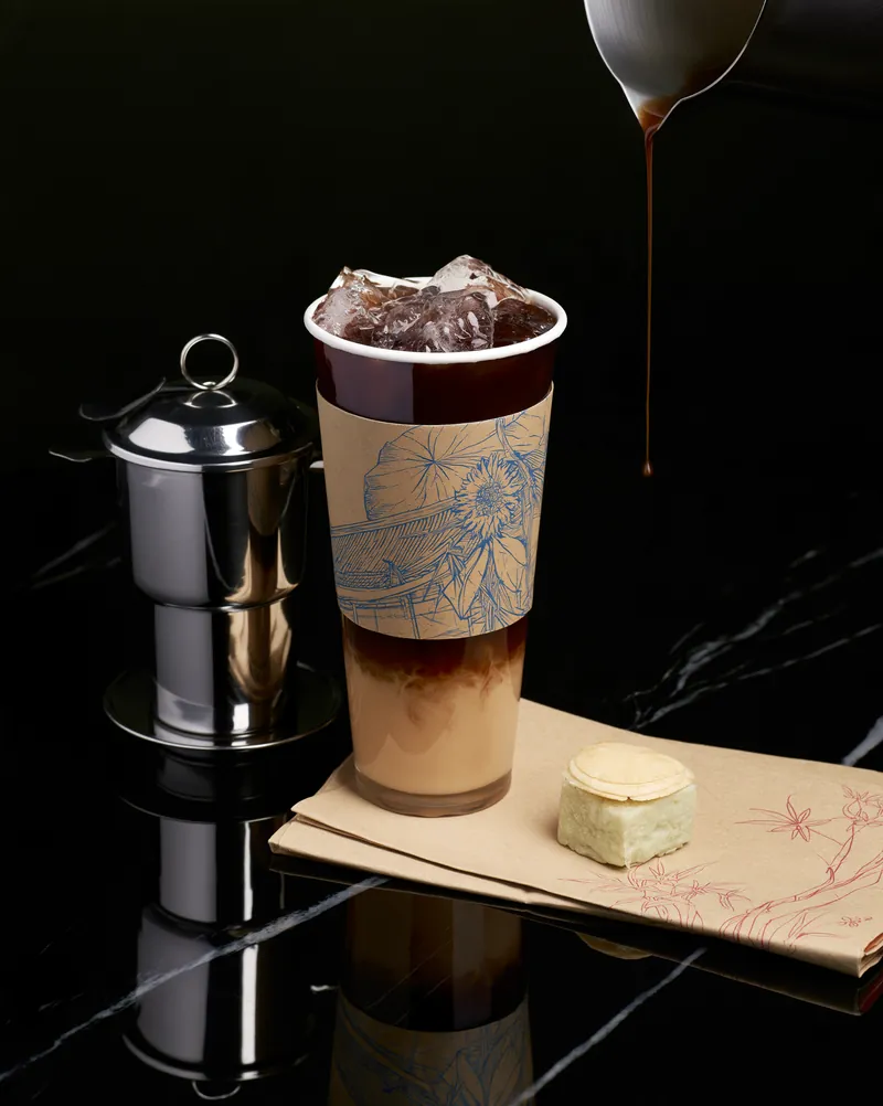 Mahjong Coffee fiber cup with Vietnamese-inspired illustration.